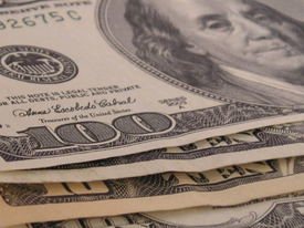 one hundred dollar bills stacked