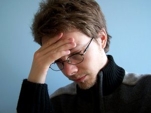 Person rubbing their temples