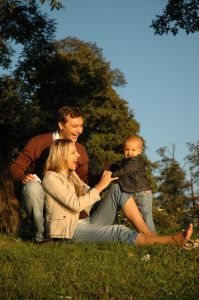 Small family sitting outside