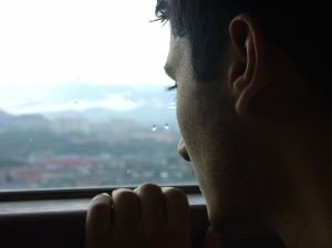 Man looking out of a window